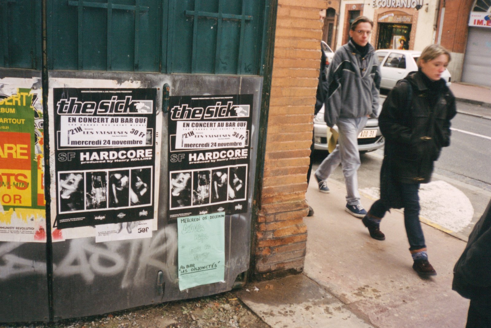 “The Sick” concert posters on a street in France — SF Hardcore, produced by Henry Rollins